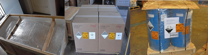 Industrial packaging and shipping materials including wooden crates, cardboard boxes, and wrapped pallets